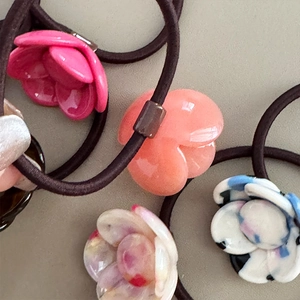 Elegant camellia flower hair scrunchies with glossy finish and high elastic brown hair rope