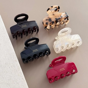 Five assorted retro square hollow claw clips in burgundy black and leopard textures
