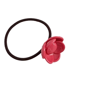 Elastic hair tie with a vibrant pink acetate flower charm for stylish ponytails