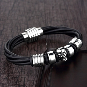 Men's punk rock multi-strand black braided leather bracelet with a silver skull pendant