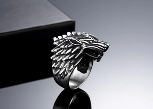 Macro side view of vintage punk wolf head ring with detailed oxidized steel finish