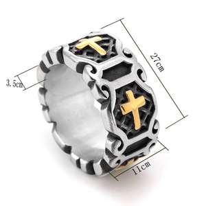 Vintage stainless steel ring featuring a golden cross relief and retro silver industrial design