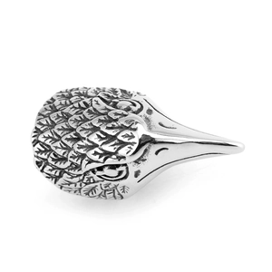 Macro shot of vintage eagle head ring in stainless steel with detailed feather carving