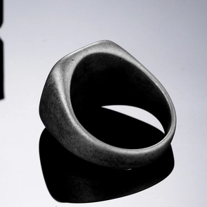 Men's vintage titanium steel signet ring with a matte dark grey distressed finish