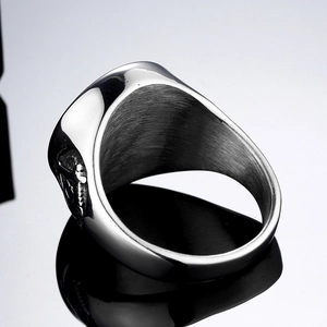 Vintage punk skull ring in titanium steel with polished edges and inner brushed texture