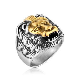 Detailed close-up of a two-tone lion head ring with gold and silver polished finishes