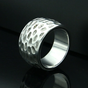 Men's wide stainless steel ring featuring textured honeycomb design and polished finish
