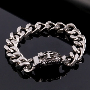 Close-up of hip-hop skull clasp on heavy duty polished stainless steel Cuban link bracelet
