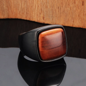 Men's matte black titanium steel ring featuring a square tiger eye gemstone centerpiece