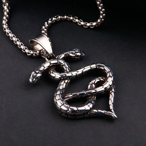 Double-headed snake heart pendant in stainless steel with textured scales and box chain