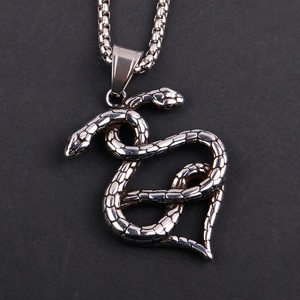 Detail view of double snake heart pendant in stainless steel with textured scales