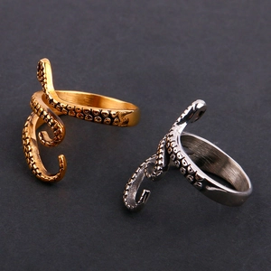 Detailed close-up of octopus tentacle rings in silver and gold with suction cup textures