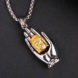 Detailed close-up of retro stainless steel Buddha pendant with gold and silver dual tones
