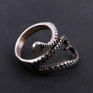 Macro detail of the vintage silver octopus tentacle ring showing realistic suction cups