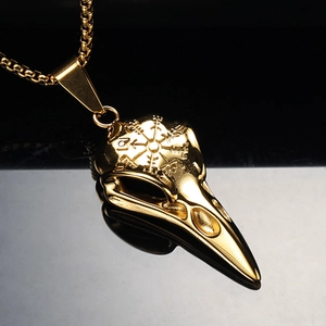 Golden Viking crow skull necklace with Vegvisir compass engraving on polished steel