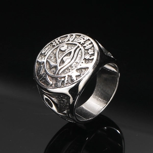 Macro shot of Egyptian Eye of Horus and mysterious runes on vintage steel ring