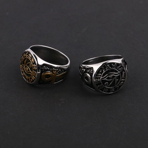 Detail of vintage Eye of Horus and Ankh symbols on stainless steel signet rings