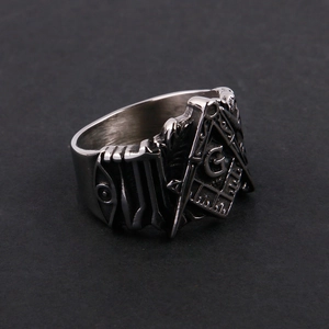 Macro shot of Freemason Masonic symbol with All-Seeing Eye on a vintage steel ring