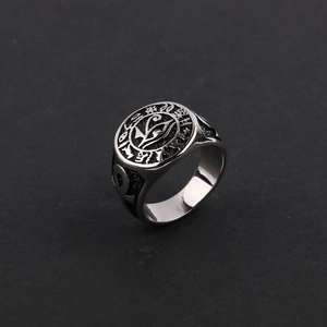 Detailed macro shot of vintage stainless steel signet ring featuring the Eye of Horus symbol
