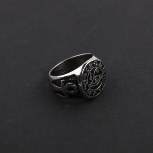 Detailed macro view of vintage stainless steel signet ring with Eye of Horus and Ankh symbols