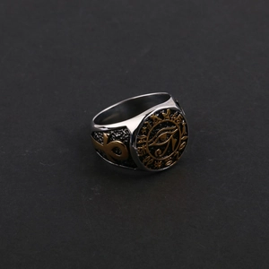 Detail view of vintage Egyptian ring with gold Eye of Horus and Ankh symbols