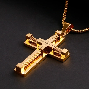 Macro shot of gold double-layer stainless steel cross pendant with woven wire texture