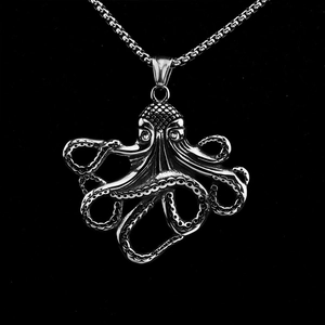 Vintage silver octopus pendant necklace with detailed tentacles on black background