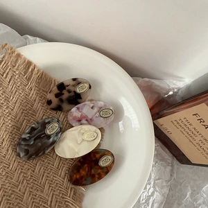 Five-piece set of acetate oval hair clips with gold metal plates in various marble patterns