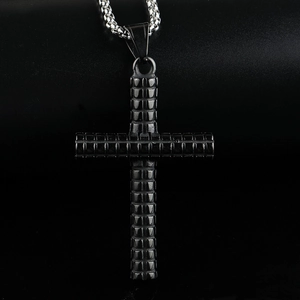Macro shot of punk solid stainless steel cross pendant with checkered texture and box chain