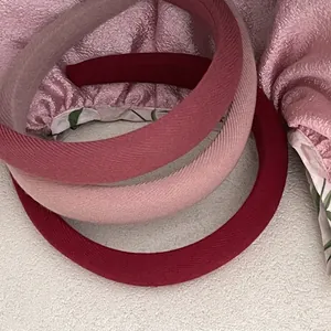 Three-piece set of wide padded fabric headbands in berry colors for thick hair volume