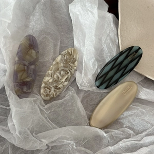 Minimalist acetate oval hair clips with marble patterns and French handmade engraving