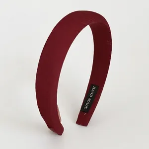Minimalist deep red fabric headband with high top design and wide brim for women