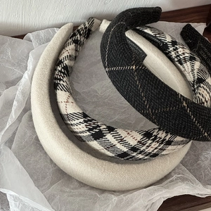 Three-pack vintage plaid and solid color padded sponge headbands for a high skull top look