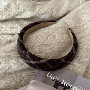 Detail of dark brown plaid wool wide headband with soft anti-slip suede lining