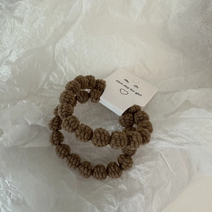 Brown plush hair ties in 2-pack with soft knit texture on white background