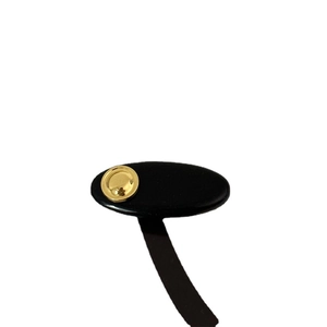 Minimalist black acrylic hair clip with a gold metallic disc accent and sleek design