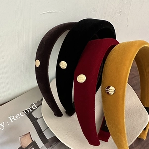 Set of four vintage velvet padded headbands with gold labels in assorted classic colors