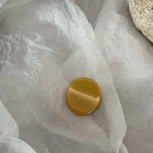 Amber acetate round mini hair claw clip with gold FRANCE Handmade label on white paper