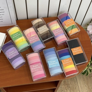 Set of 10 boxes featuring colorful candy-colored high elasticity hair ties for ponytails