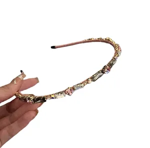 Elegant rose gold headband with rectangular and round crystals for a high skull top hairstyle