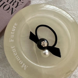 Vintage camellia pearl hair tie with black bow and gold floral metal accents
