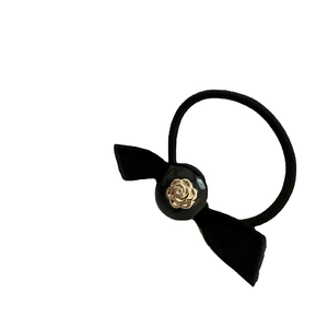 Vintage camellia flower hair tie with velvet bow and gold metal rose detail