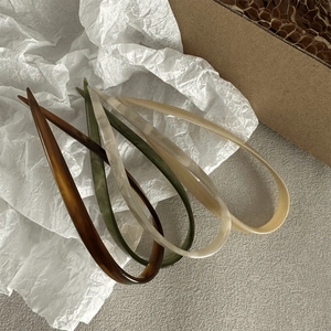 Set of four tortoiseshell acetate U-shaped hair pins in elegant vintage colors