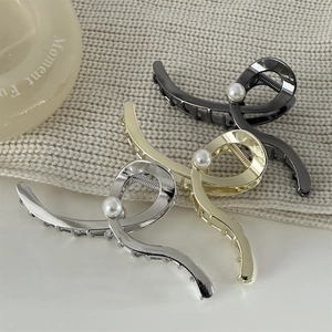 Three-piece wave-shaped alloy claw clips in gold, silver, and black with faux pearls
