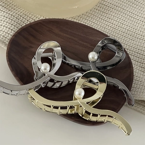 Elegant wave metal hair clips with pearl detail in gold silver and gun grey finishes