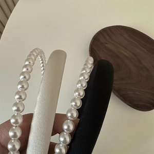 Three-piece hairband set with elegant faux pearl strand and minimalist padded fabric bands