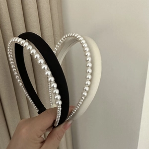 Detailed view of elegant double-layered satin headbands with glossy white pearls set of two