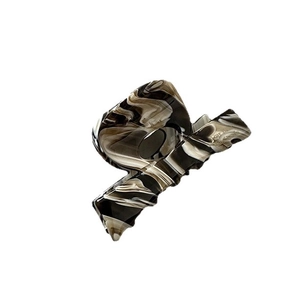 Elegant marble pattern acetate hair claw clip with a glossy finish for a modern minimal look