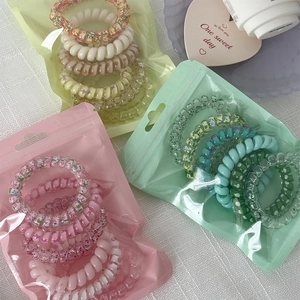 Candy gradient telephone cord hair ties set in colorful pastel translucent pouches