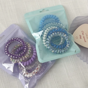 Pastel gradient spiral hair ties set in purple and blue shades for traceless styling